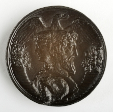 Medal depicting two-faced head