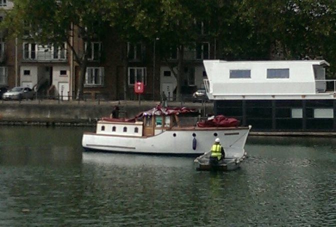 Ngaire's boat being towed in for some maintenance